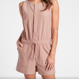 Like new Athleta romper. Pull tie waist, pockets and button down front.